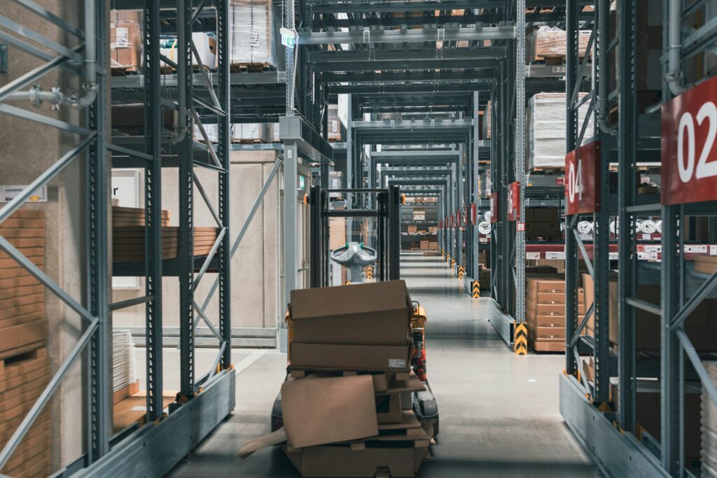 Warehouse management best practices demonstrated through organized storage aisles and efficient inventory movement