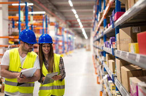 Warehouse employees working together on counting products