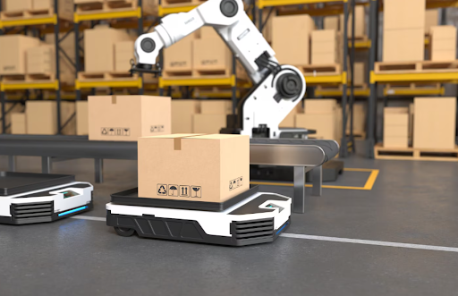The robot arm picking up the box