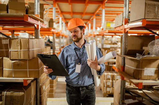 Warehouse manager reviewing performance data in a storage facility