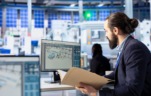 Warehouse manager reviewing warehouse simulation results on a computer