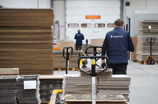 Warehouse workers moving materials to improve warehouse labor productivity