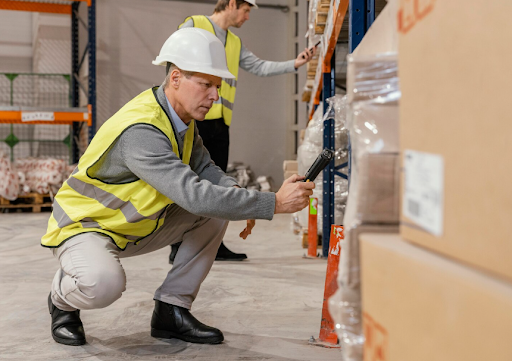 Warehouse worker scanning inventory during a labor performance review